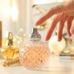 Bottles with perfume on a white table